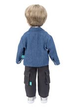 Doll wearing a blue jacket and black pants on a white background