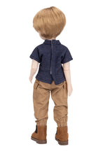 Doll wearing a blue shirt, brown pants, and brown boots on a white background