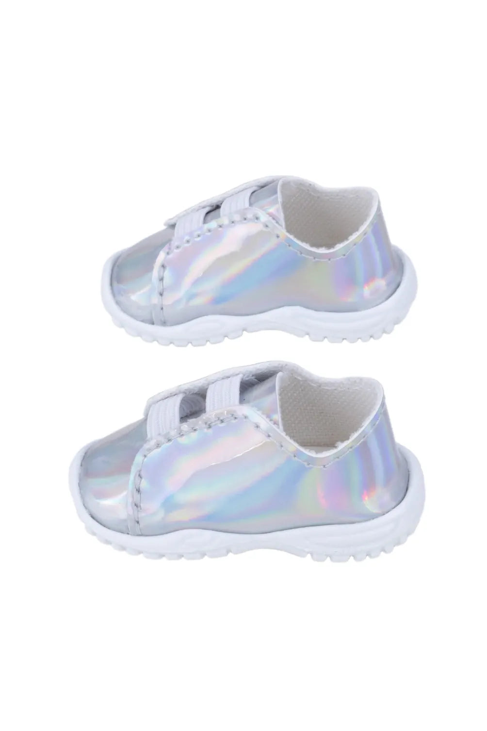 Pair of iridescent doll sneakers on a white background