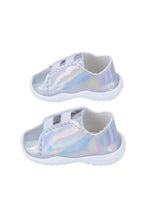 Pair of iridescent doll sneakers on a white background