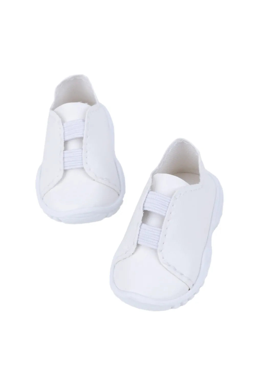 Pair of white doll sneakers on a white background
