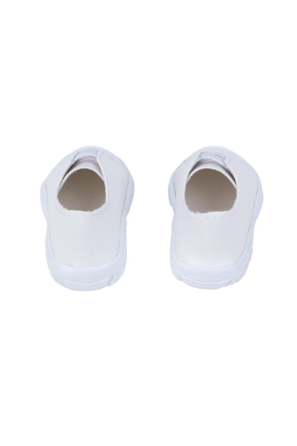 Pair of white doll sneakers on a white background