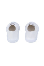 Pair of white doll sneakers on a white background