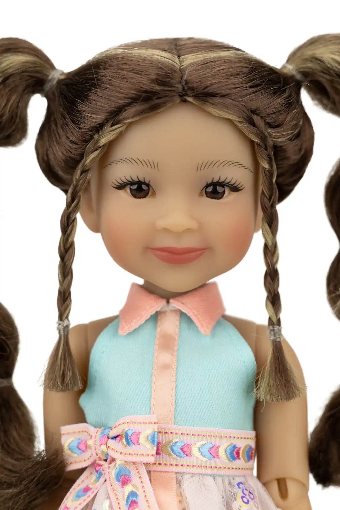 Abby with braided hair and a colorful outfit on a white background