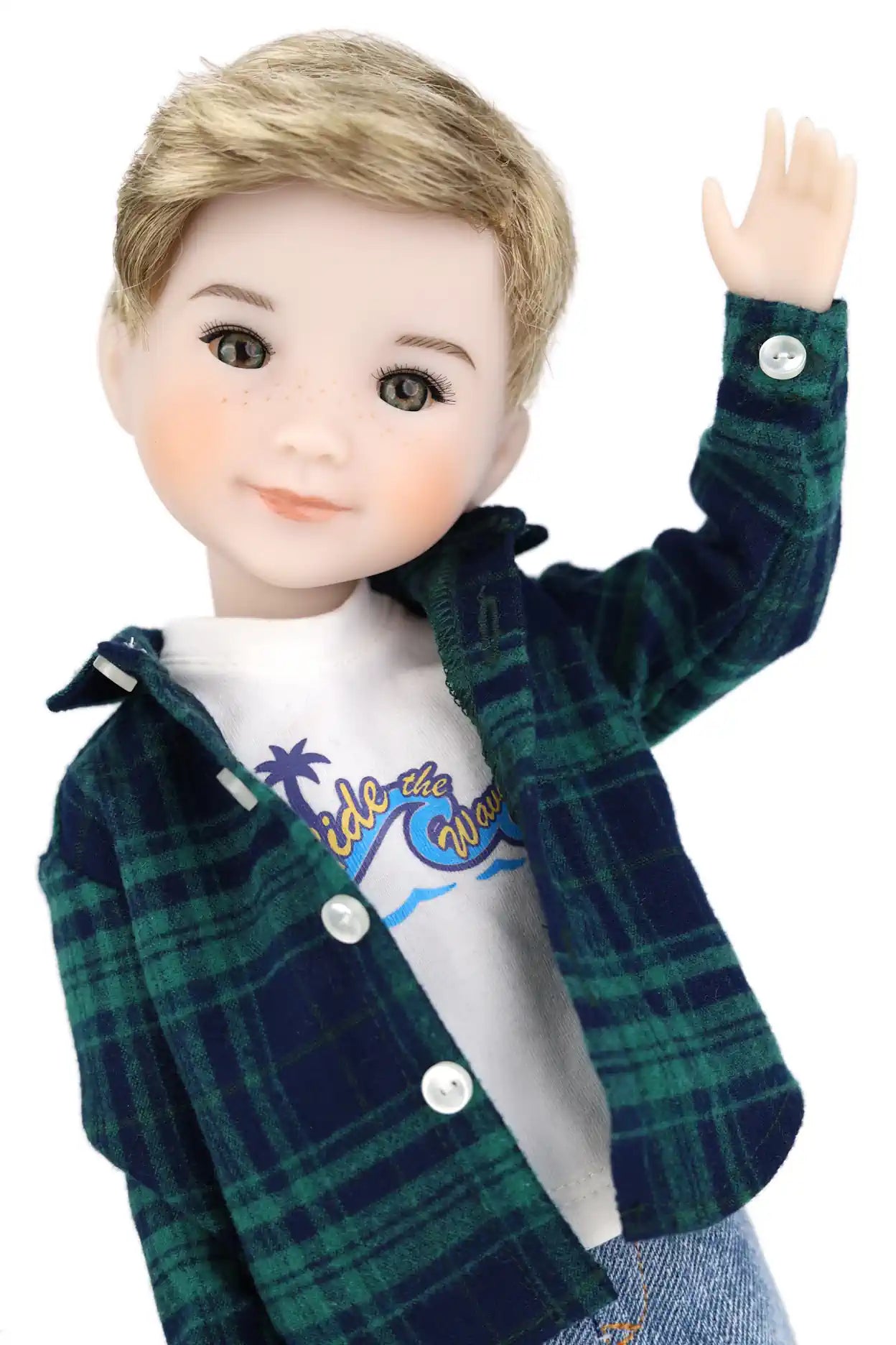 Doll wearing a green plaid jacket over a white shirt with blue text