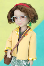 Ava wearing a yellow outfit with a red headband and glasses, standing against a colorful background.