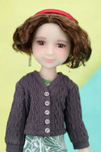 Ava wearing a purple cardigan with a colorful background