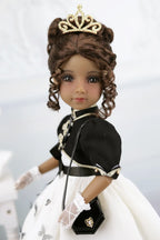 Esther in a formal outfit with a tiara on a light gray background