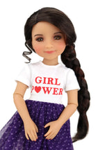 Freida wearing a white shirt with 'GIRL POWER' text and a purple skirt on a white background