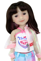 Hanna, long brown hair with pink highlights in a sheer pink jacket, white tank, and tie-dye shorts.