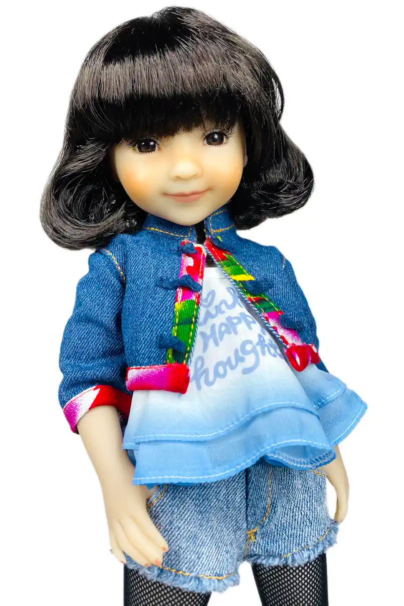 Hanna wearing a blue jacket with colorful accents and a white shirt with text.