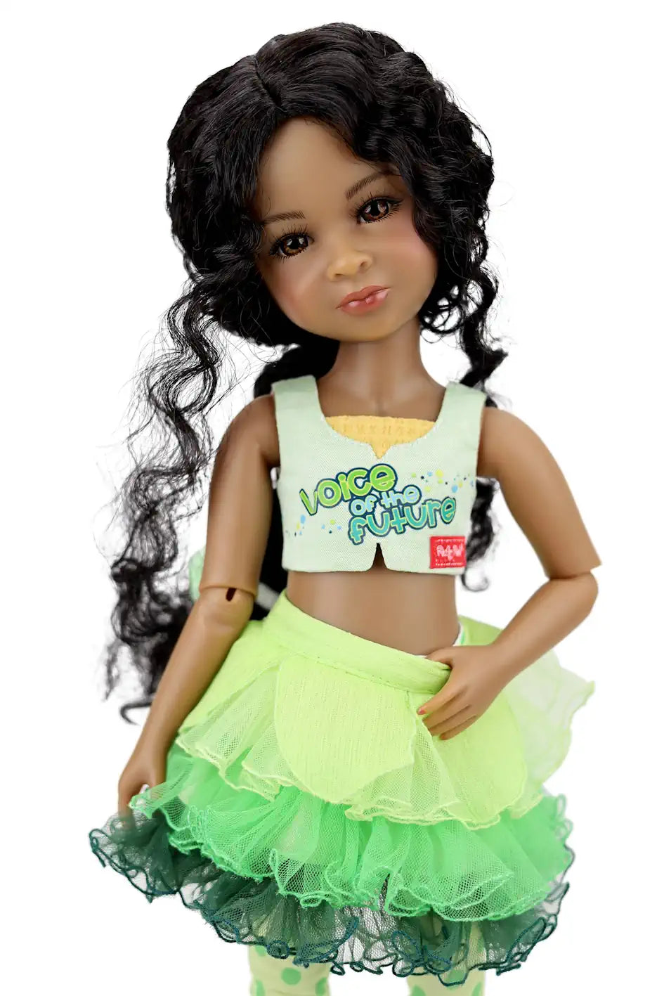 Doll with green outfit and white top on a white background