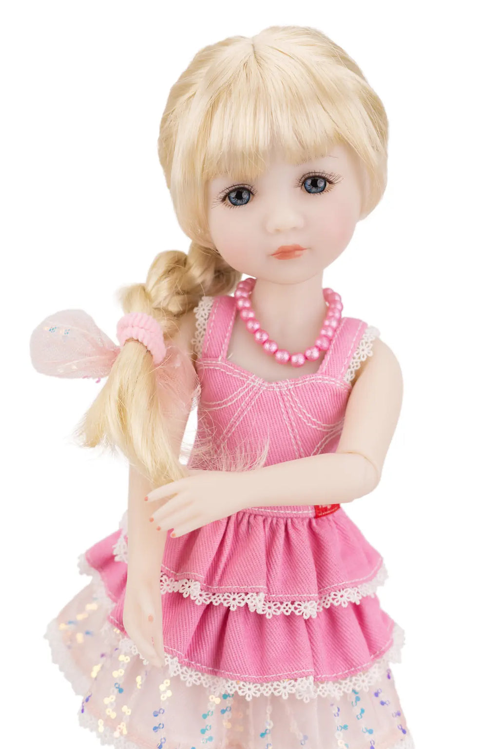 Karina with blonde hair and a pink dress on a white background
