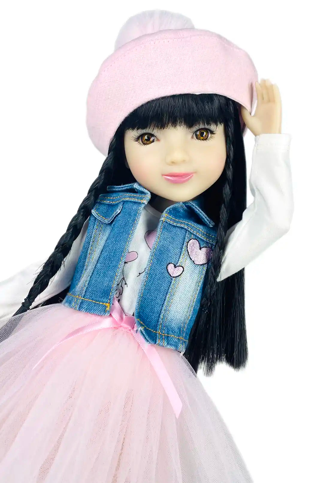 Lila wearing a pink hat, denim jacket, and pink skirt on a white background