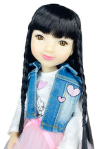Lila with long black hair, denim jacket with heart designs, and pink skirt on a white background