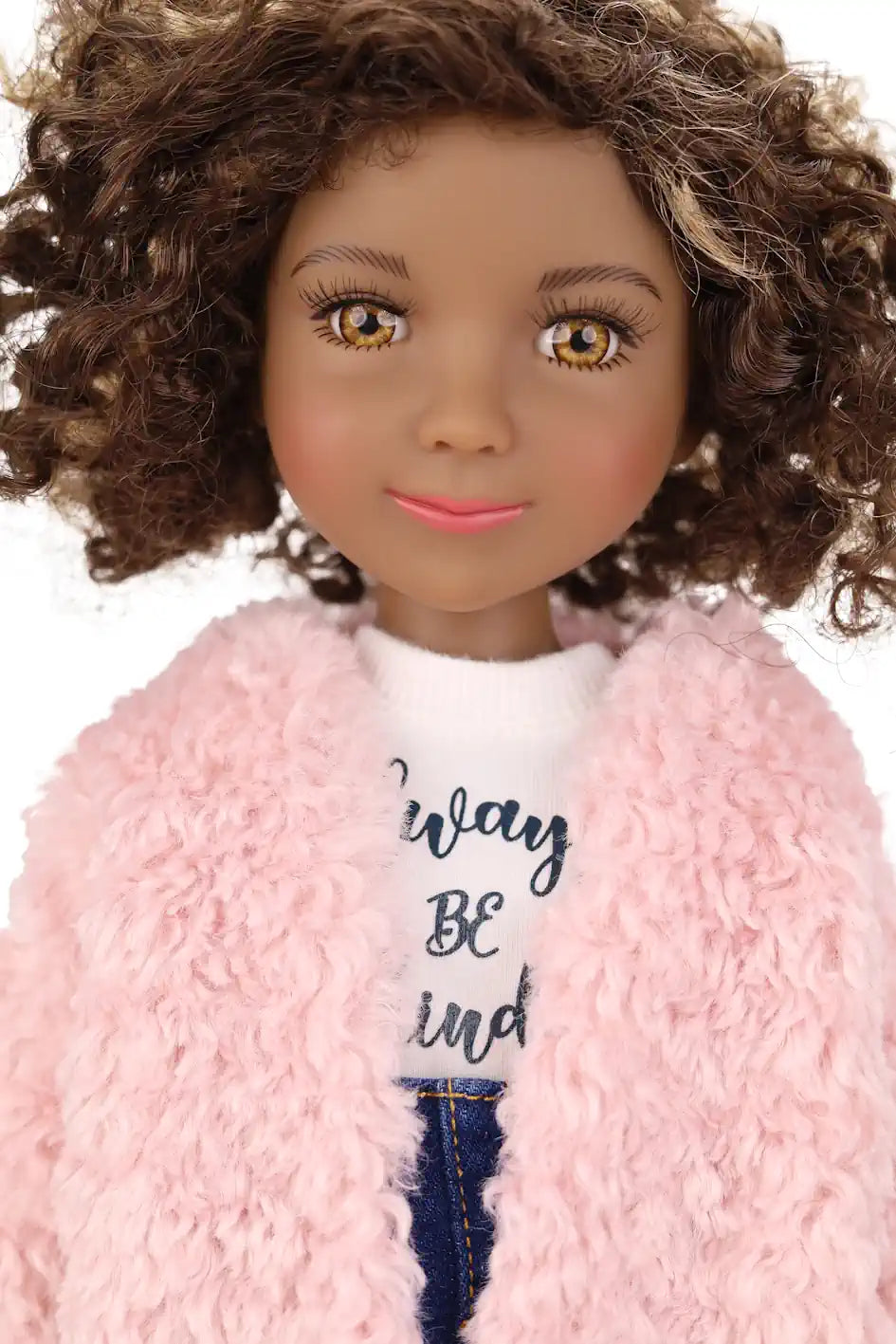 Maya wearing a pink fuzzy coat over a white shirt with text, on a white background