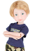 Rory wearing a blue shirt with text and camouflage pants on a white background