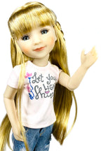 Sara with long blonde hair wearing a white t-shirt with text and blue jeans on a white background