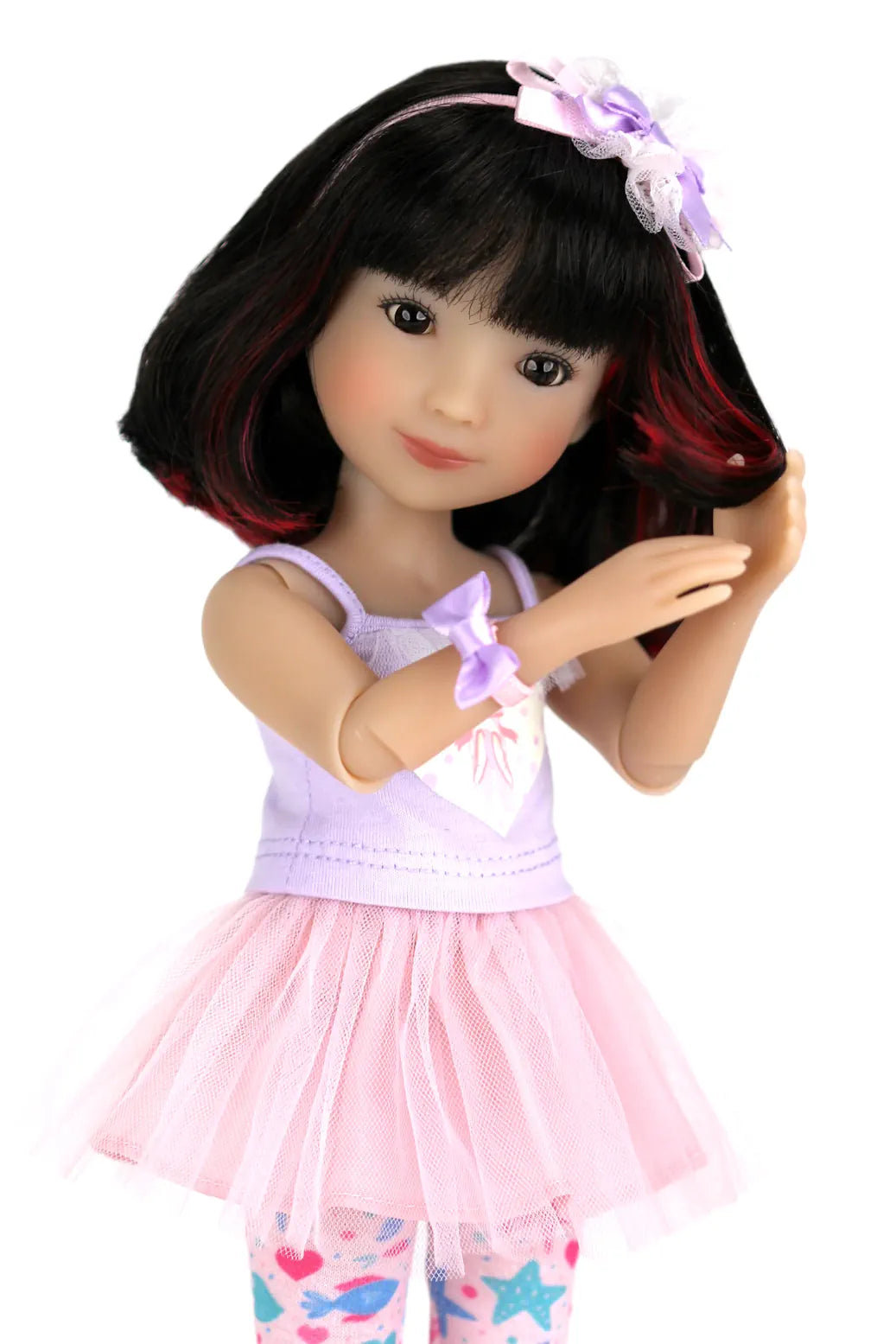 Sydney with black hair, pink headband, and pink outfit on a white background