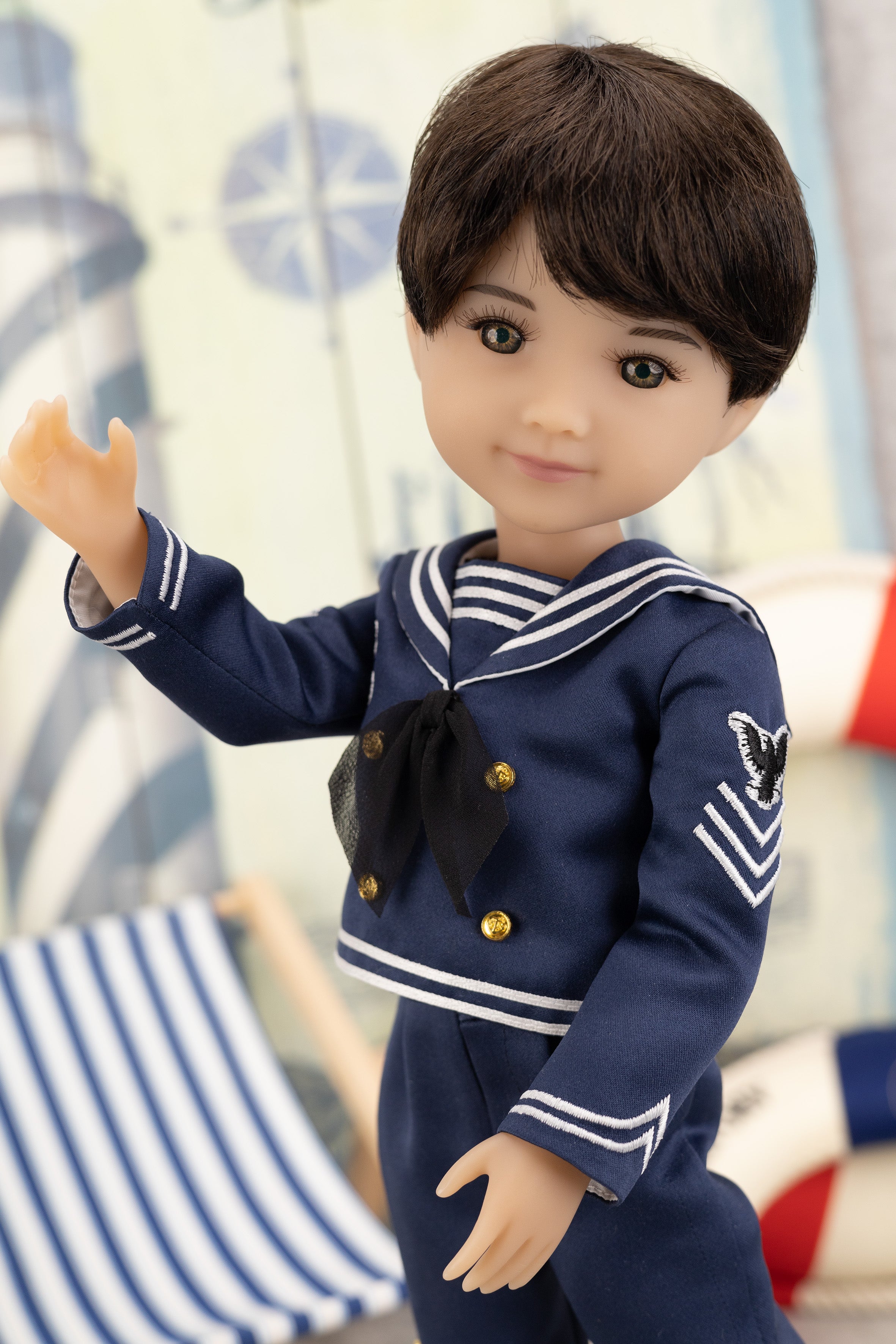 Tyler in a navy blue sailor outfit with a blurred background