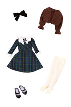 Plaid dress with accessories including a brown cardigan, white shoes, and cream stockings on a white background