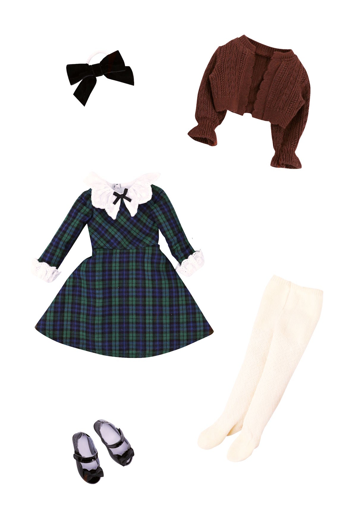 Plaid dress with accessories including a brown cardigan, white shoes, and cream stockings on a white background