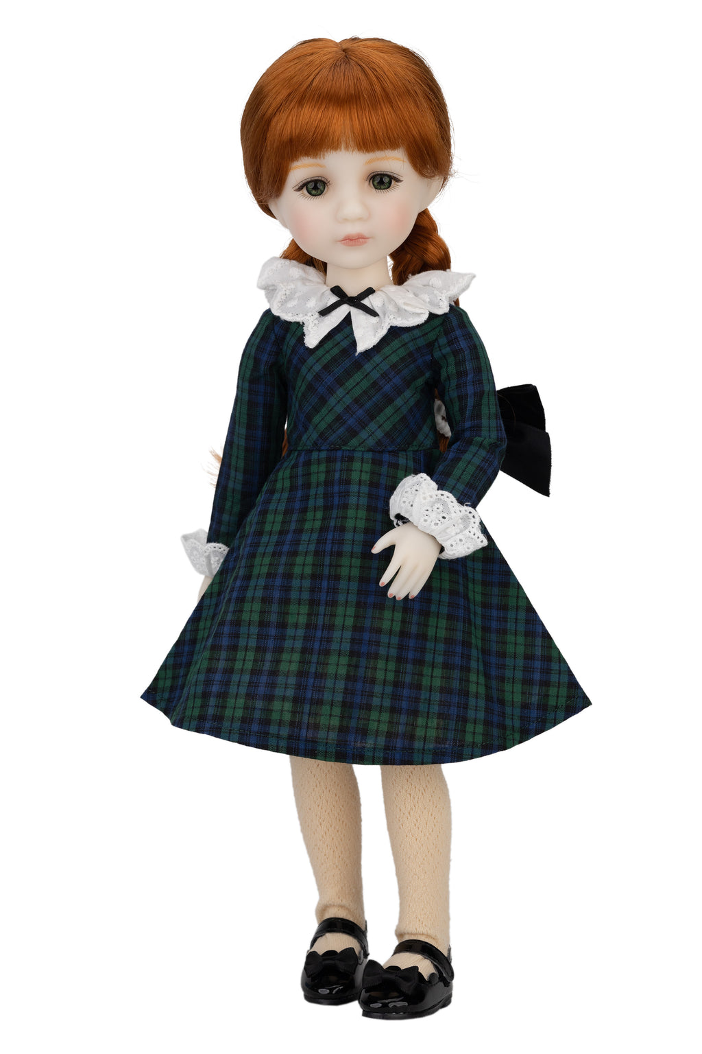 Doll wearing a plaid dress with a white collar and black shoes on a white background