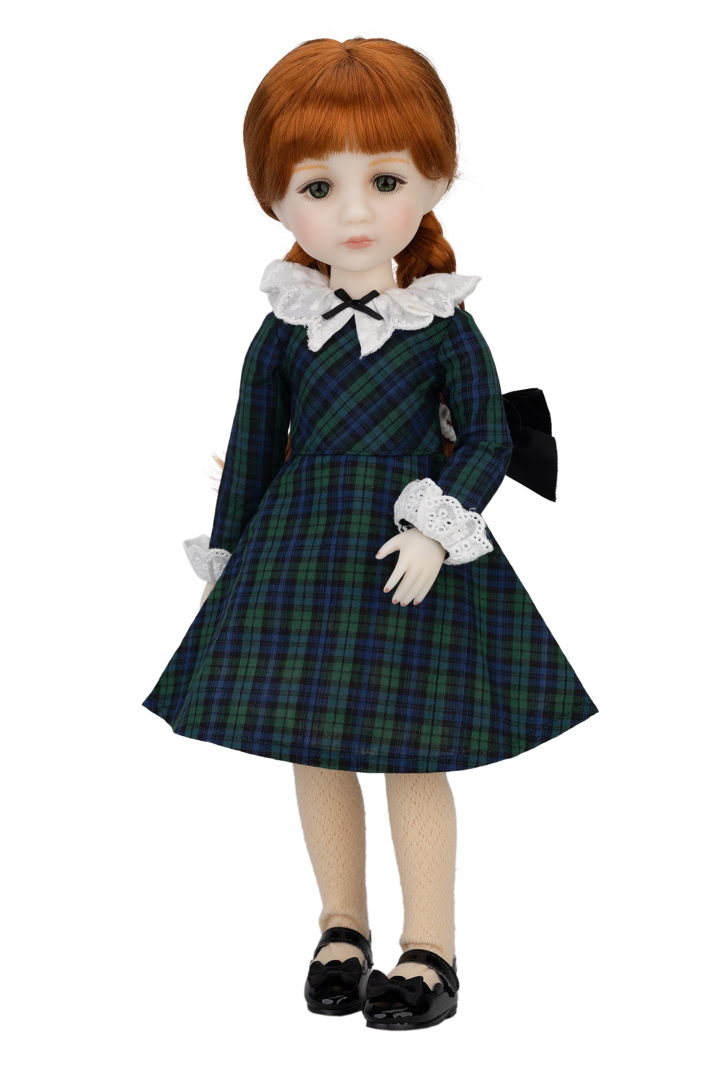 Doll wearing a plaid dress with a white collar and black shoes on a white background