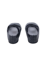Pair of black doll shoes on a white background