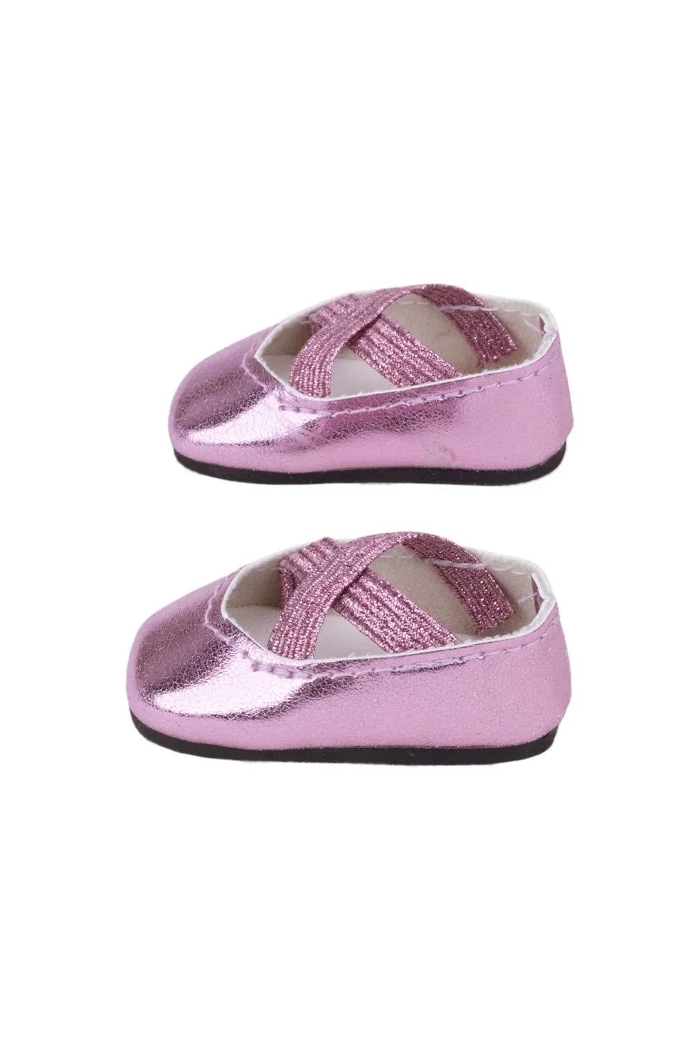 Pair of pink metallic doll shoes on a white background