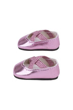 Pair of pink metallic doll shoes on a white background