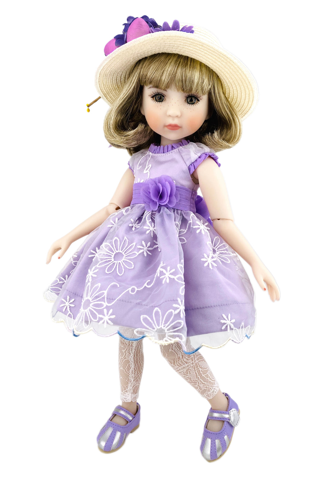 Doll wearing a purple dress with white floral patterns and a matching hat on a white background