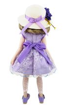 Doll wearing a purple dress with floral patterns and a matching hat on a white background