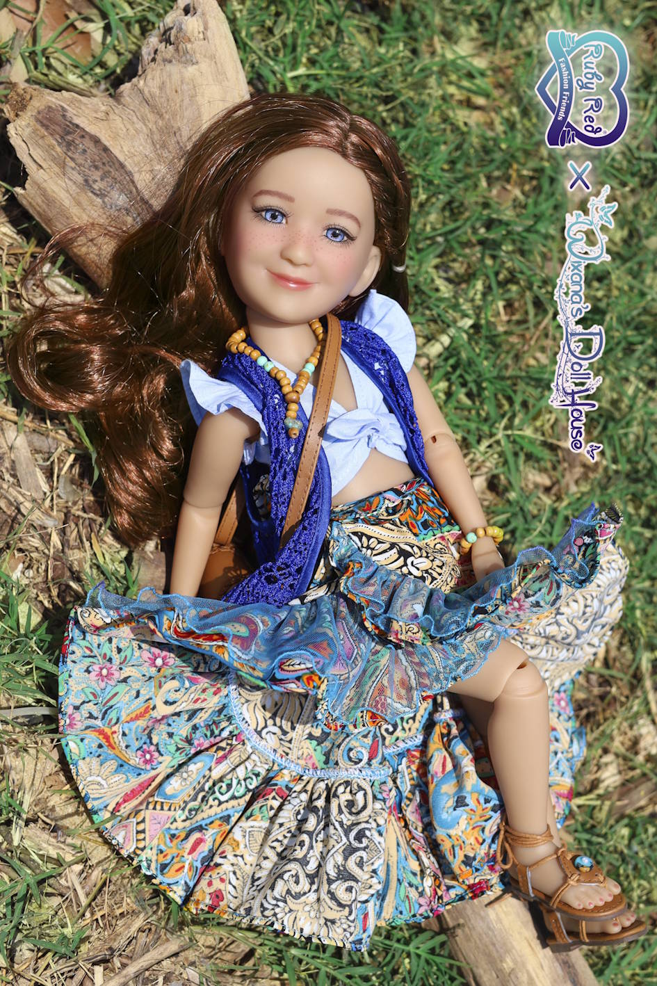 Doll with a colorful outfit sitting on grass