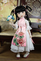 Traditional doll in a floral dress with a decorative fan, set against a decorative background.
