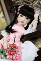 Doll in a traditional outfit with floral design on a blurred background