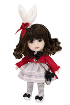 Doll with rabbit ears and a red outfit on a white background