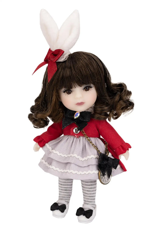 Doll with rabbit ears and a red outfit on a white background