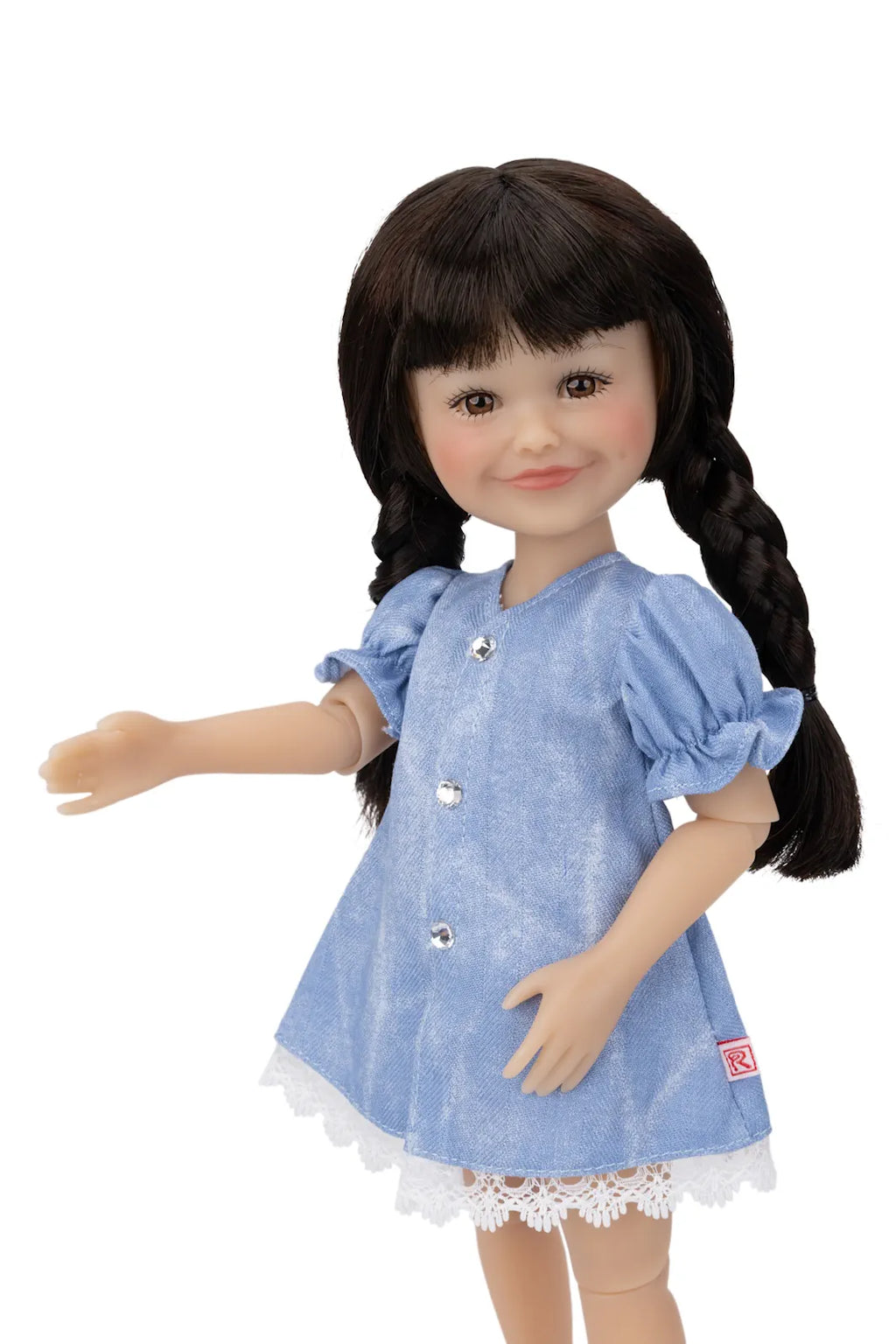 Doll wearing a blue dress with lace trim on a white background