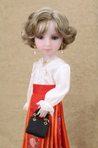Doll wearing a white blouse and red skirt with a black handbag on a beige background