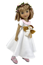 Doll in a white dress with a small doll and flower crown on a white background