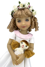 Doll with floral crown and white dress holding a small doll