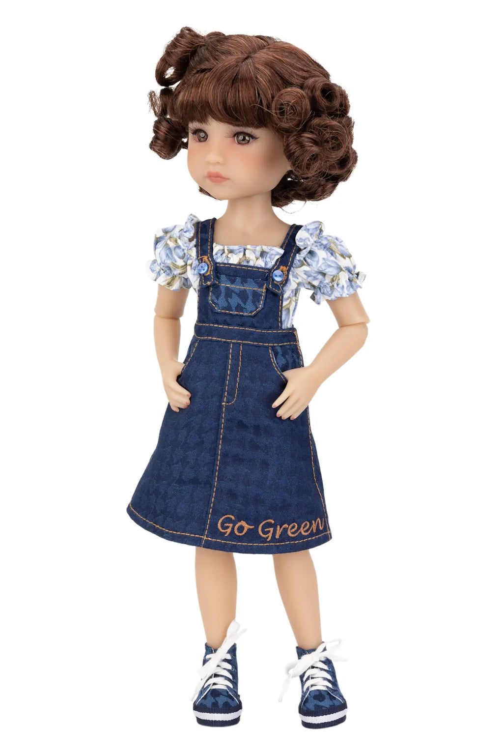 Doll wearing a denim dress with 'Go Green' text on a white background