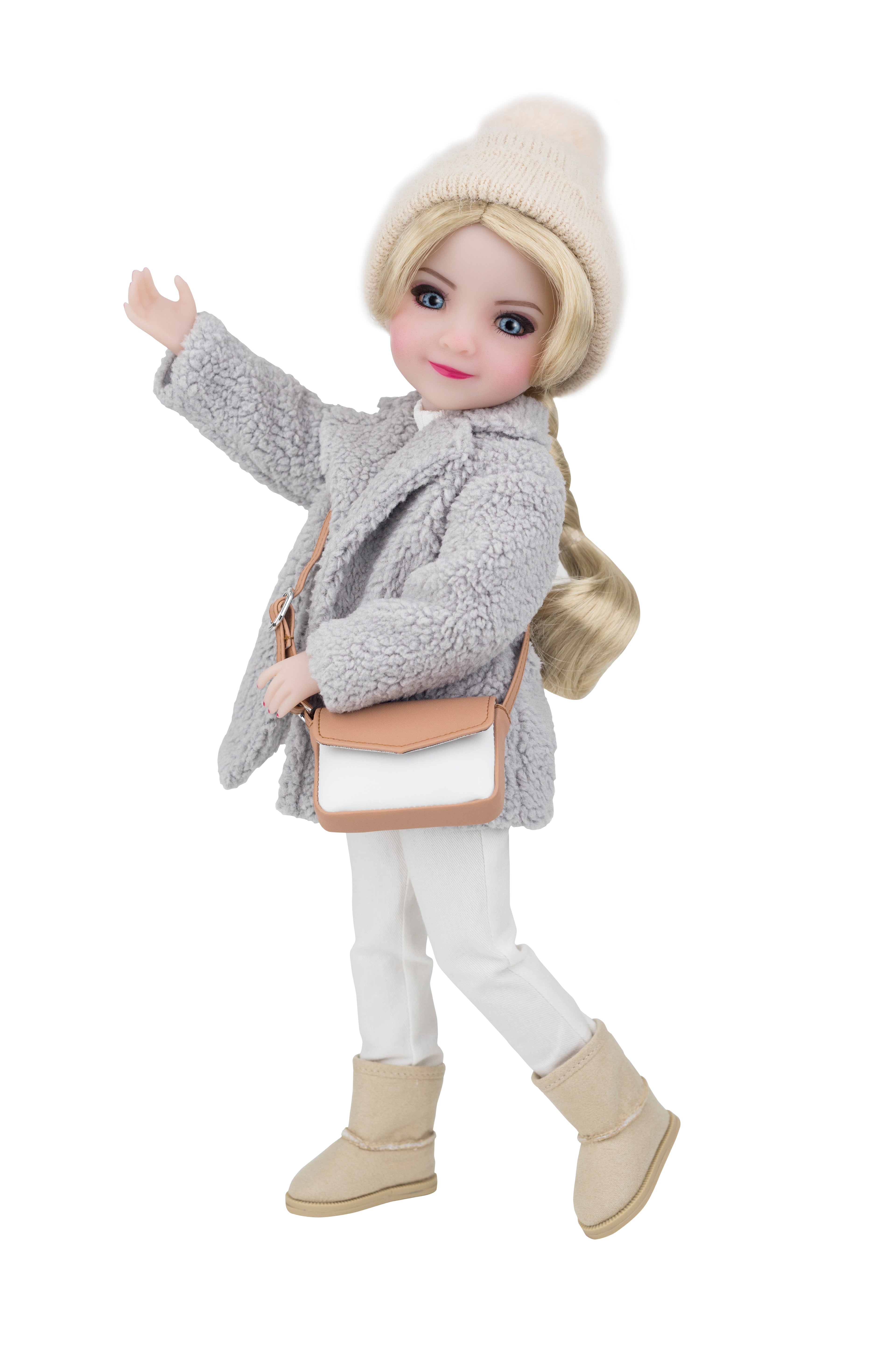 Doll wearing a gray coat, white pants, beige boots, and a cream beanie with a beige handbag.
