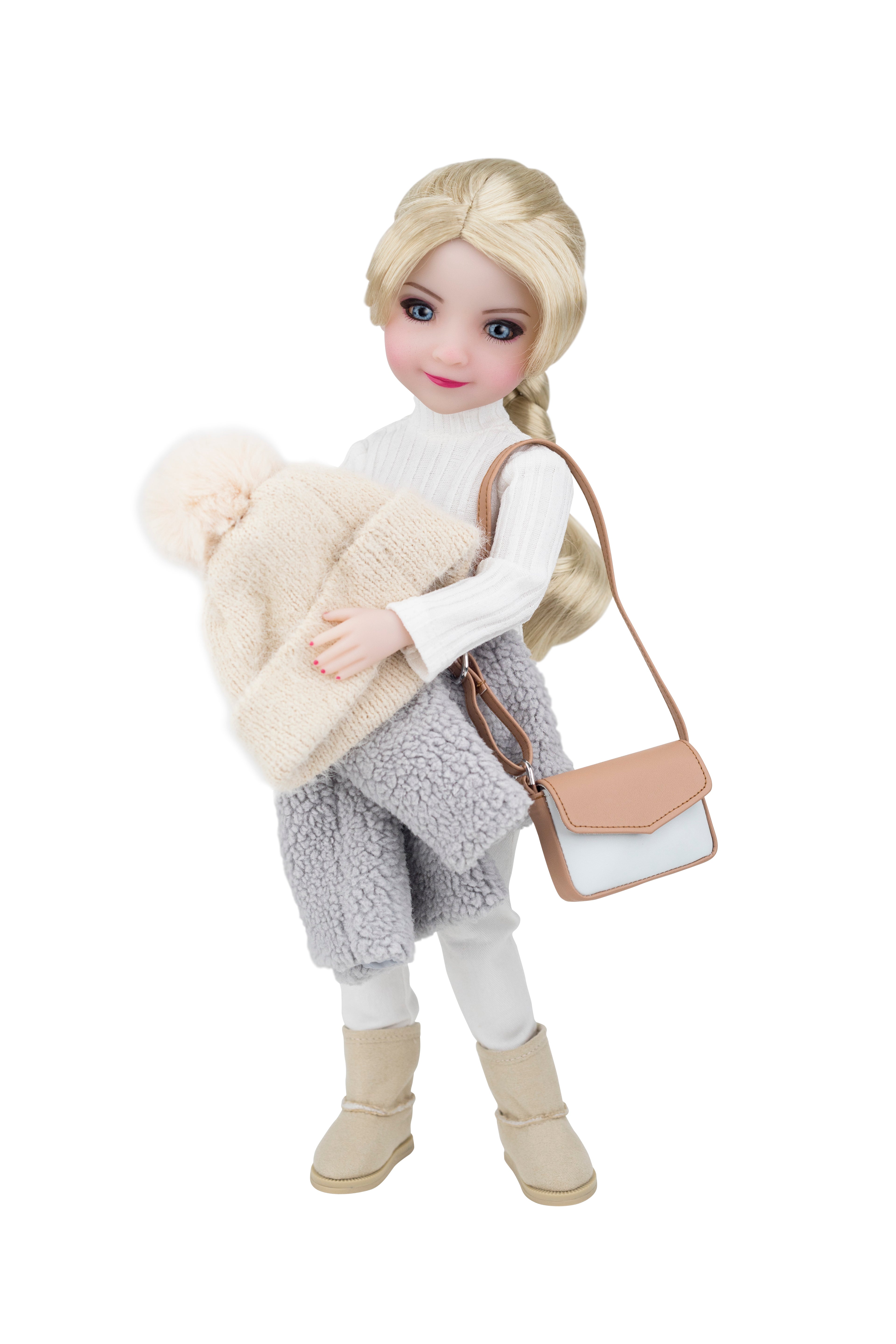 Doll wearing a winter outfit with a beige bag and white sweater on a white background
