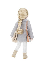 Doll with braided hair wearing a gray coat and white pants on a white background