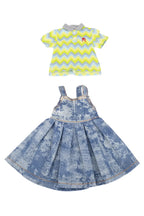 Two doll outfits on a white background: a yellow and blue striped romper with a Ruby Red logo and a denim dress with floral pattern.