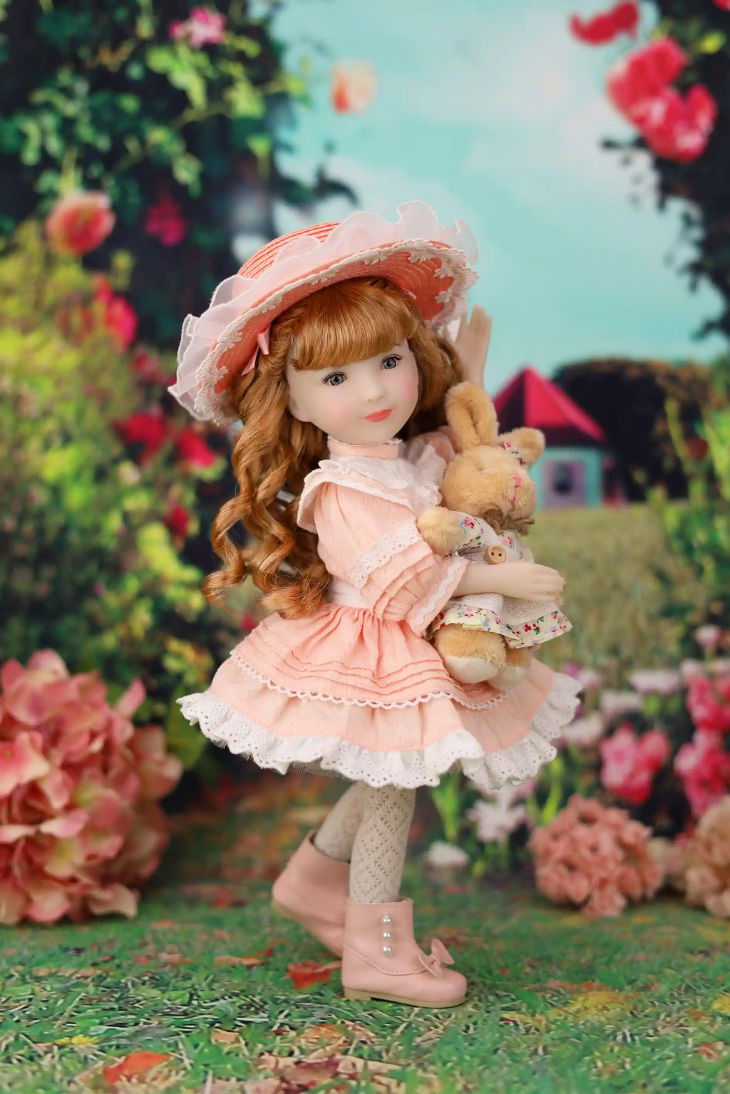 Doll with red hair and a pink dress holding a rabbit plush toy in a garden setting