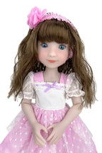Doll with brown hair and a pink dress on a white background