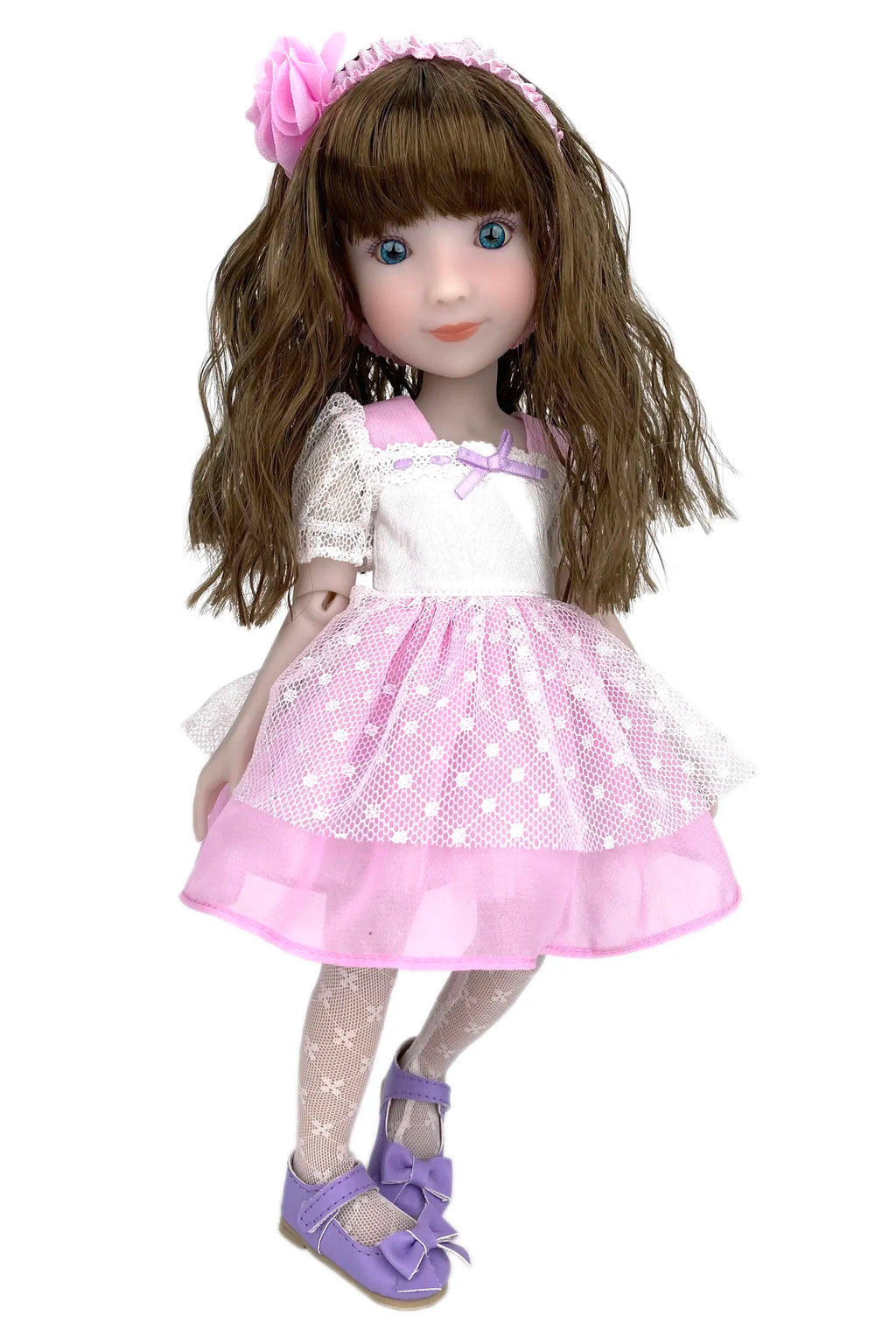 Doll with long brown hair wearing a white dress with pink accents and purple shoes on a white background